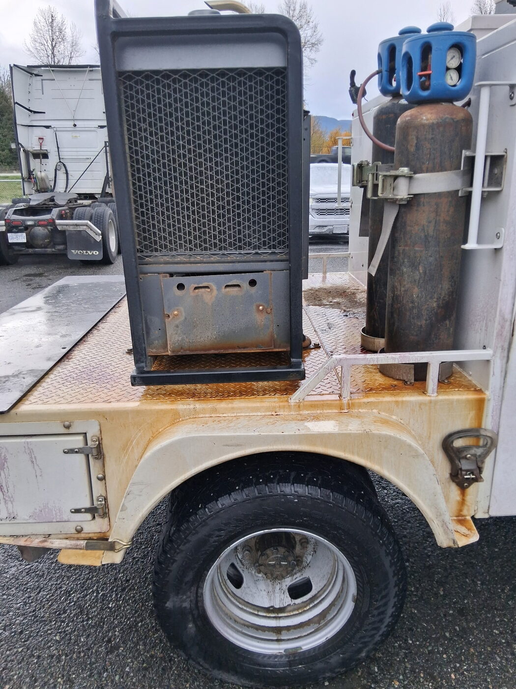 Service truck deck before — rust-stained and grimy